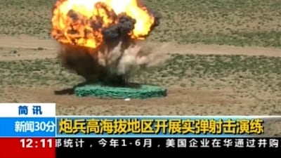 The Chinese army conducting a live-fire drill on August 4, 2017 in the Tibet autonomous Region which borders India. The yellow Chinese characters read: "Artillery soldiers high altitude live fire drills". Photo: CCTV via AP