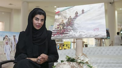 Budour Al Ali, an Emirati Artist, pays tribute to the UAE’s fallen soldiers through her painting, which currently exhibiting in Al Seef Village Mall. Mona Al Marzooqi / The National