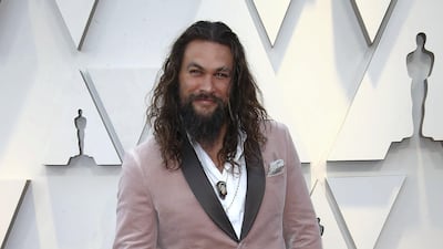 2019: Jason Momoa wears blush velvet Michael Kors at the 91st Annual Academy Awards on February 24, 2019. Getty Images