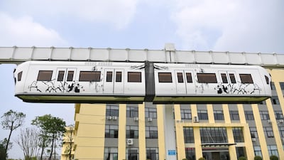 An elevated monorail train travels along a 1.4km test track at China Sky Railway in Chengdu in July 2017. The air rail runs five metres above the ground and follows similar developments in Japan and Germany. Xinhua / Shutterstock