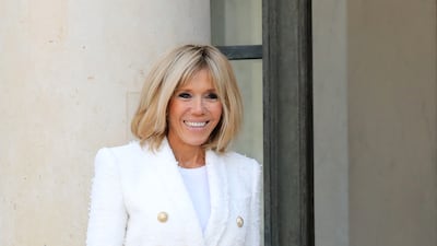 Brigitte, wearing a white blazer and trousers, on February 21, 2018. AFP