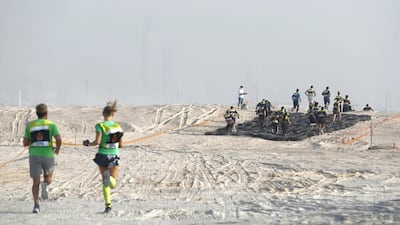 Participants set off on the first leg of the race towards the first obstacle of Tough Mudder sports event held on Hudayriat Island in Abu Dhabi.