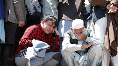 Relatives mourn the victims of an explosion during a mass funeral ceremony in Kabul, on July 7, 2021. Reuters