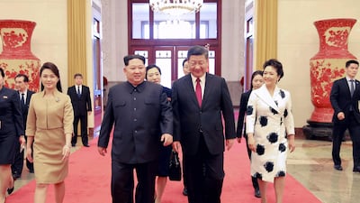 North Korean leader Kim Jong-un and his wife Ri Sol-ju walking with Chinese President Xi Jinping and his wife Peng Liyuan during their meeting in China. According to the North Korean media, Kim Jong-un visited China from 25 to 28 March at the invitation of Chinese President Xi Jinping. EPA / KCNA