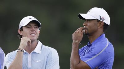 Rory McIlroy, left, and Tiger Woods stand together during the first round of the 2013 US Open golf tournament at Merion Golf Club in Ardmore, Pa. (AP Photo/Darron Cummings, File)