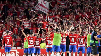 Granada players celebrate their 2-0 win over Barcelona. EPA