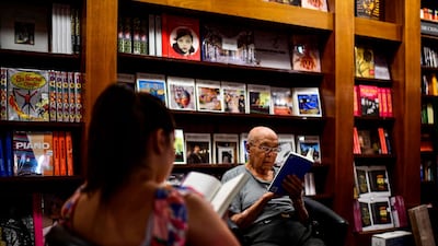 People read books in the "El Ateneo Grand Splendid" bookstore . AFP