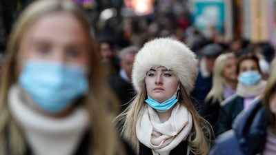 Some shoppers wearing face coverings to combat the spread of the coronavirus in central London. AFP