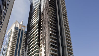 Five years after Tamweel Tower burnt, residents want the finalities taken care of and their keys back. Antonie Robertson / The National