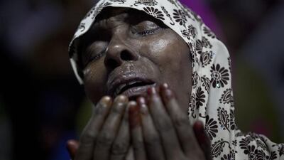 A woman cries as she prays at Baitul Mukarram, the National Mosque, on Eid Al Fitr July 18, 2015 in Dhaka, Bangladesh. Allison Joyce / Getty Images