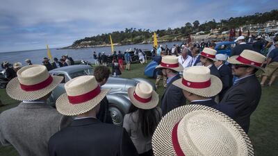 Judges view cars on display. Bloomberg