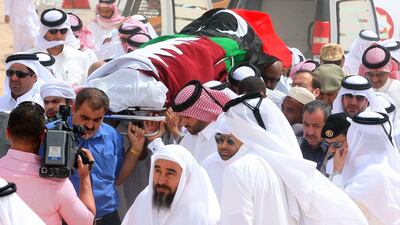 The coffin of Al Jazeera news network cameraman Ali Hassan al Jaber, covered in the flags of Qatar and the Libyan rebels, is carried at his funeral in Doha today. The Al Jazeera cameraman was killed in an ambush near the eastern Libyan city of Benghazi on Saturday, the first journalist killed in the nearly month-long conflict.