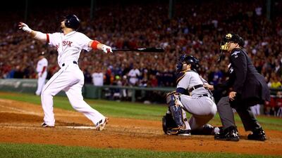 Shane Victorino, left, hit a critical grand slam on Saturday night to propel the Boston Red Sox into the World Series. Al Bello / Getty Images / AFP