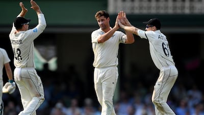 Colin de Grandhomme of New Zealand, centre, celebrates with teammates after taking the wicket of Steve Smith. EPA