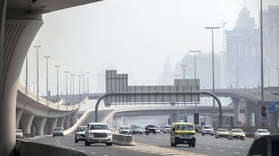 Traffic passes through an underpass as Dubai enters the peak of summer. Antonie Robertson / The National