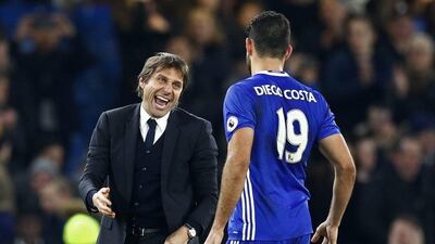 Chelsea's Diego Costa and manager Antonio Conte celebrate after their win over Stoke City. Eddie Keogh / Reuters
