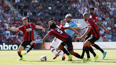 Manchester City's Sergio Aguero scores City's third goal. Reuters