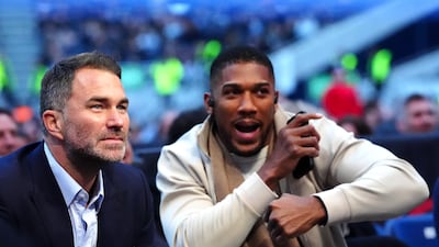 Anthony Joshua with promoter Eddie Hearn and in the stands at Tottenham Hotspur Stadium for Tyson Fury's fight against Arslanbek Makhmudov. PA