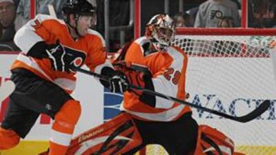 Ray Emery, pictured right in goal for Philadelphia with teammate Ryan Parent last month, kept his first shutout for the Flyers on Friday night as they defeated the Carolina Hurricanes 2-0.