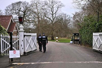 Police at the gates to Royal Lodge, the Berkshire former home of Andrew Mountbatten-Windsor. AFP
