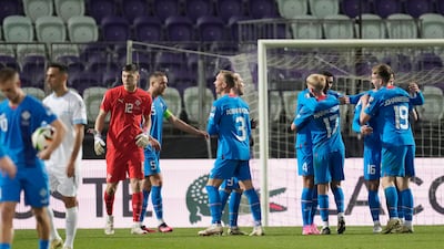Iceland players celebrate at the end of the Euro 2024 qualifying play-off victory over Israel. AP
