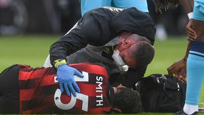 Adam Smith - 7: Typified Bournemouth's battling spirit. Carried off on a stretcher with a head injury in the second period. EPA