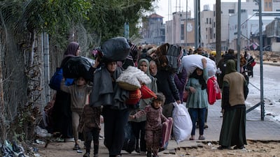 Palestinians arrive in Rafah, southern Gaza, having fled an Israeli ground and air offensive in the nearby city of Khan Younis on Monday. AP