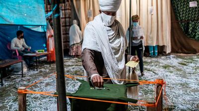 A Ethiopian Orthodox Priest casts his ballot at a polling station during Tigray’s regional elections, in the city of Mekele, Ethiopia. AFP