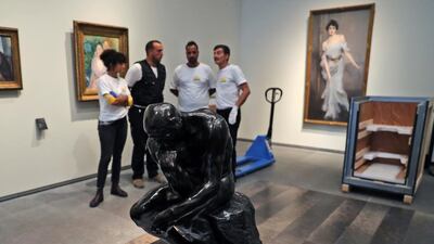 The staff removed the Rodin's 'Thinker' bronze statue from it's package to install it at the Louvre Museum in Abu Dhabi. Kamran Jebreili / AP photo