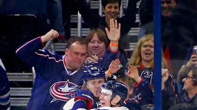 Matt Calvert, No 11, of the Columbus Blue Jackets is congratulated by William Karlsson, No 25, of the Columbus Blue Jackets after scoring a short-handed, game-winning goal, during the third period of the game against the New York Rangers. Kirk Irwin / Getty Images / AFP