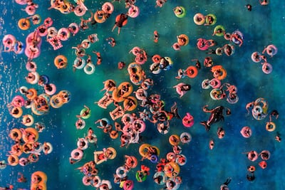 This aerial photo shows people cooling off at a water park amid hot weather in Nanjing, in eastern China's Jiangsu province. AFP