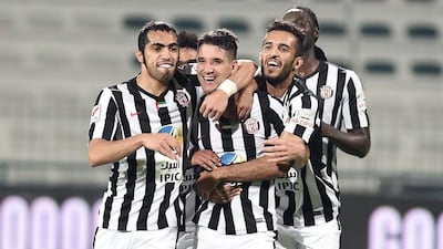 Al Jazira players celebrate a goal against Al Shabab in the Arabian Gulf League earlier this month. Photo Courtesy / AGL / February 14, 2016