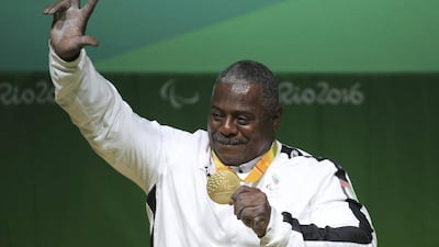 Gold medalist Mohammed Khalaf of the UAE poses with his medal on the podium after lifting 220kgs to claim gold in the men's under-88kg powerlifting competition at the Rio 2016 Paralympic Games. Sergio Moraes / Reuters