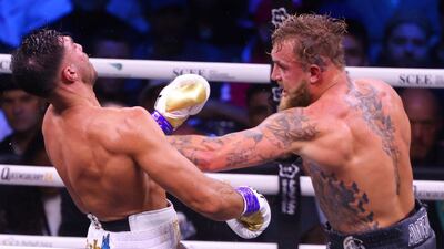 Jake Paul connects with Tommy Fury. EPA
