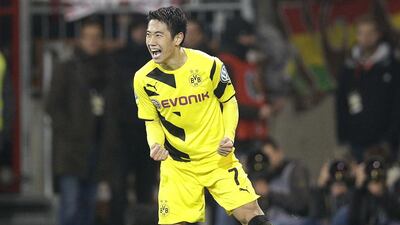 Shinji Kagawa has found his pre-Manchester United form in recent weeks to help Dortmund's late season revival. Michael Sohn / AP Photo