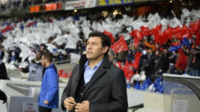 Lyon coach Hubert Fournier is pictured during the French Ligue 1 match against Angers on December 5, 2015, at the Gerland stadium in Lyon, eastern France. / AFP / JEAN-PHILIPPE KSIAZEK
