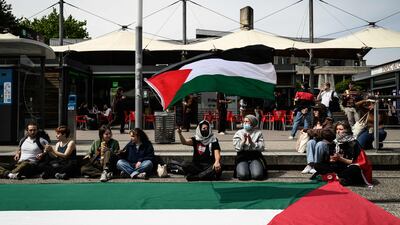 Students wave Palestinians flag during a rally near the entrance of an Institute of Political Studies building in Grenoble, France. AFP
