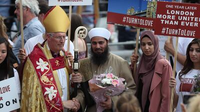 The Bishop of Southwark, Christopher Chessun, meets members of the public during a commemoration service. AFP/Daniel LEAL-OLIVAS