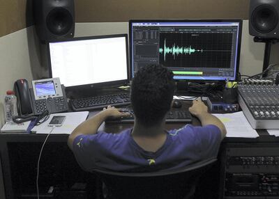 Omar Hanoun, a senior promo producer at Al Oula Radio, produces a new feature for Ramadan. Satish Kumar for The National