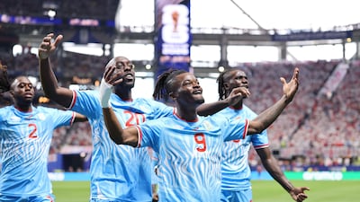 Brian Cipenga celebrates with his Congo teammates after scoring. Getty Images