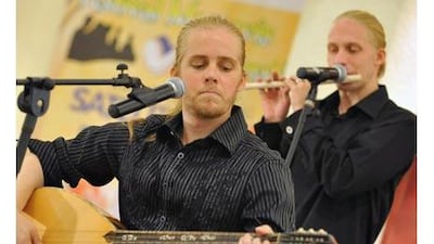 Mustafa Daood, left, performs with his band Debu at a shopping mall in Serpong on the outskirts of Jakarta in September.