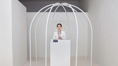 A woman stands at the entrance of one of the galleries during Art Dubai 2012.