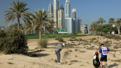Tiger Woods plays his second shot on the eighth hole. David Cannon / Getty Images