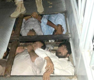 Men and several women were crammed into a tight space beneath the vehicle's floor. Courtesy: Abu Dhabi Police