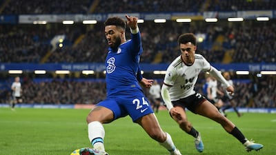 Reece James of Chelsea battles with Antonee Robinson of Fulham. Getty