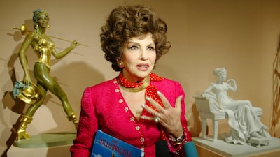 FILE - Italian actress Gina Lollobrigida speaks at the media viewing of the first exhibition of her sculptures at Moscow's Pushkin Museum of Fine Arts, on June 23, 2003. Gina Lollobrigida, the Italian actress, photographer and sculptor who was dubbed "the most beautiful woman in the world" after the title of one her movies, has died in Rome. (AP Photo / Alexander Zemlianichenko, File)