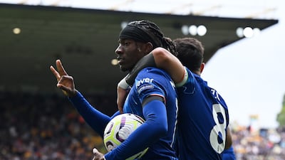 Noni Madueke of Chelsea celebrates scoring his team's fifth goal to complete his hat-trick in the 6-2 Premier League victory against Wolverhampton Wanderers at Molineux on August 25, 2024. Getty Images