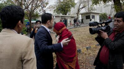 The wife of a judge who allegedly tortured her 10-year-old maid avoids the media outside the Pakistan supreme court building in Islamabad on January 6, 2017. B K Bangash / AP Photo