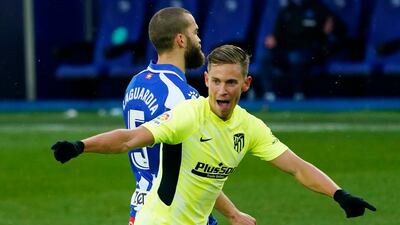 Atletico Madrid's Marcos Llorente celebrates scoring their first goal. Reuters