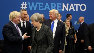 US President Donald Trump jokes with British Foreign Minister Boris Johnson at the NATO summit in Brussels on May 25 2017. AP